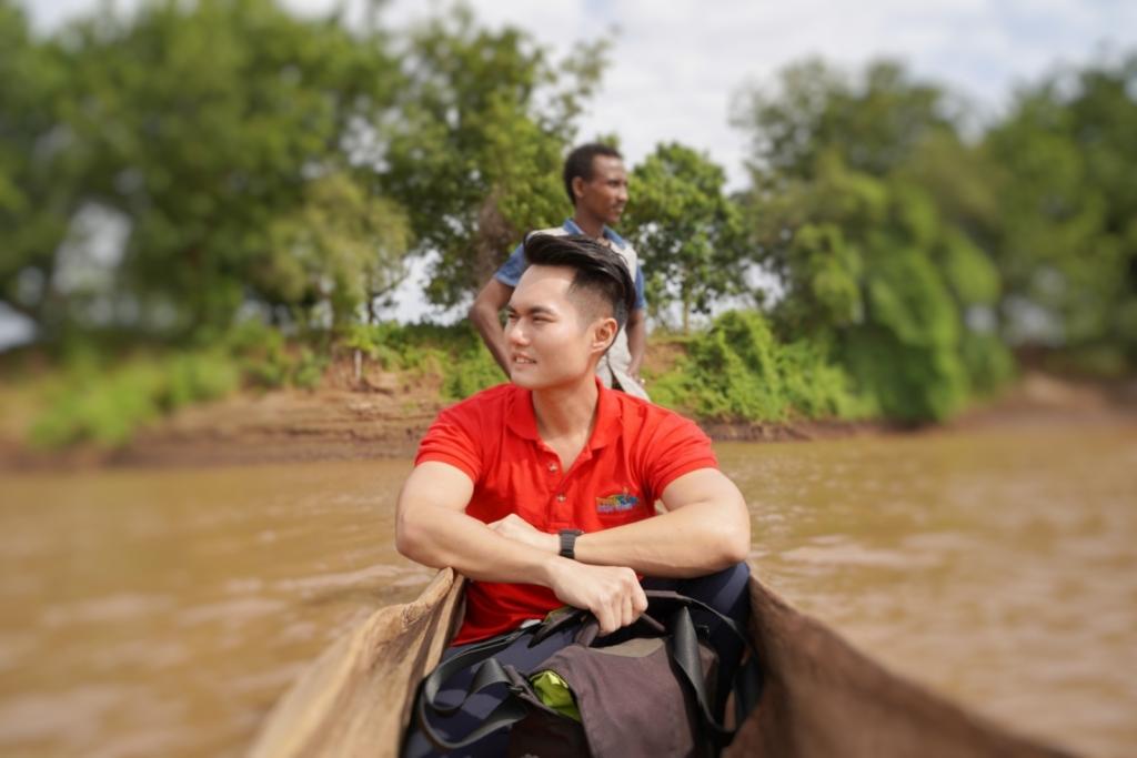 Crossing the river with dugout canoe